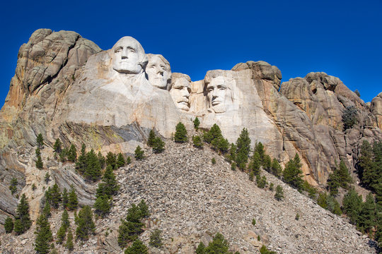 Mt. Rushmore with different views of the Presidents