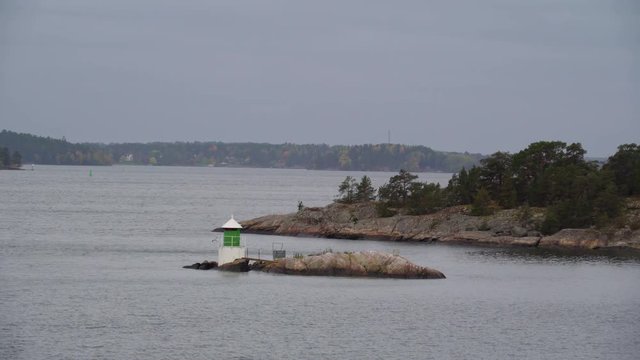 A small lighthouse on the island in Stockholm Sweden while cruising the sea on the ship