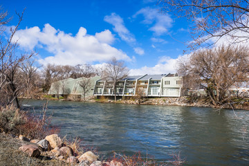 Apartment complex on the shoreline of Truckee River, Reno, Nevada; increased water level due to snow melt