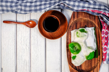 Badak berendam a local Malaysian dessert and cuf of coffee  on wooden background