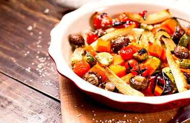 Plant based food, cooked on grill in ceramic bowl on wooden background.The concept of healthy eating. Copy space, close up.