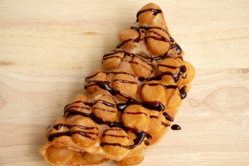Dessert Waffle Hong Kong or bubble waffle on wood background.