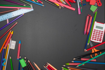 Education school tools on Black Chalkboard  Background