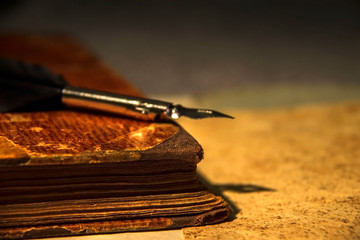 Very old book and a feather
