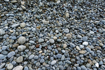 Hundreds of pebbles on a stoney beach