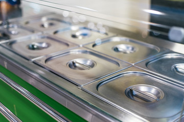 Metal polished buffet steel tray in fast food restaraunt