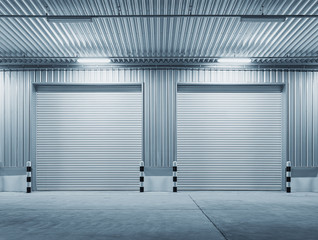 Roller door or roller shutter. Also called security door or security shutter with automatic system. For protection industrial building i.e. factory, warehouse, hangar, workshop, store, hall or garage.