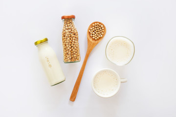 Fototapeta na wymiar Soy milk and soy bean on white background.