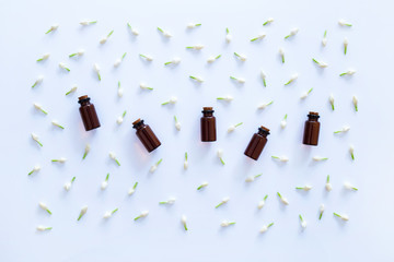 Essential oil with jasmine  flower on white background.