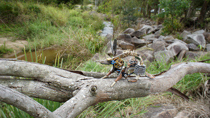 steam punk art possum sitting on tree branch