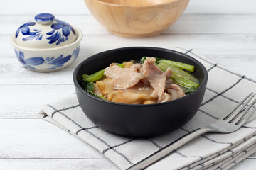 Fried noodle with pork and Chinese broccoli