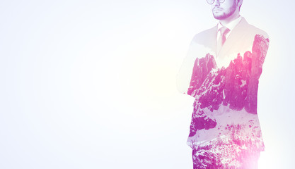  Young businessman in suit standing with sunny snowy mountain and trees graphic.