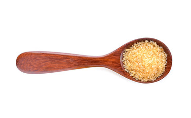 Brown sugar in wood spoon on white background