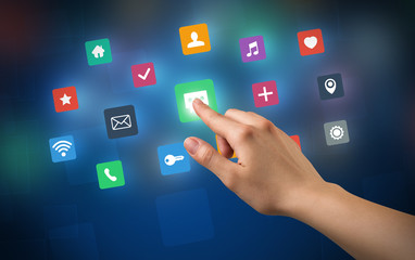 Female hand touching colorful applications 