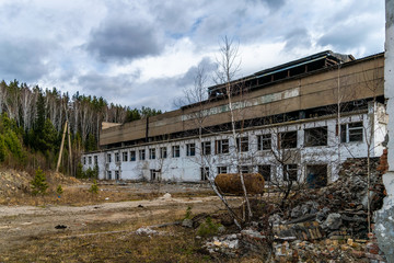 Fototapeta na wymiar Abandoned and destroyed old building