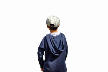 A boy wearing a winter jacket and hat standing on the white background.