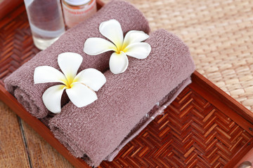 Fototapeta na wymiar Spa and wellness setting with frangipani flowers. concept for spa and Thai massage