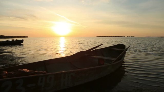 Wooden boat near the shore at dawn