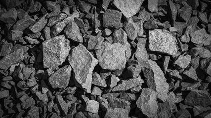 rubble texture natural abstract dark black and white vignette background close-up