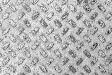 Steel sheet with notches - gray vintage metal abstract light coloured black and white background, texture close-up