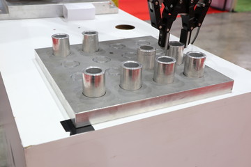 Robotic arm clamp sample and transfer in metal plate