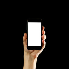 Hand holding black smartphone with blank white screen. Close up. Isolated on black background