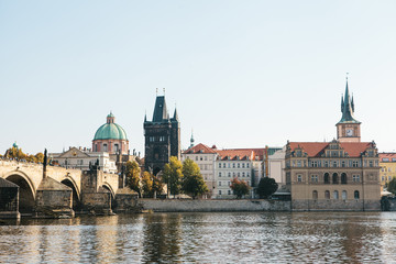 Fototapeta na wymiar Beautiful view of the cityscape including the Charles Bridge and architecture and the Vltava River in Prague in the Czech Republic.