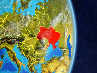 Ukraine on planet planet Earth with country borders. Extremely detailed planet surface and clouds.