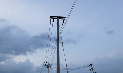 Electric post against blue sky