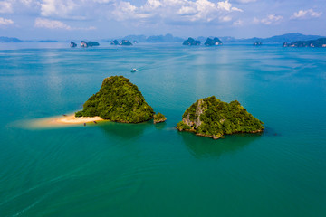 Aerial drone view of a small, beautiful tropical island with sandy beach (Ko Nok, Thailand)