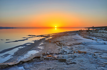 Beautiful sunrise on salt lake Chott el Djerid, Sahara desert, T