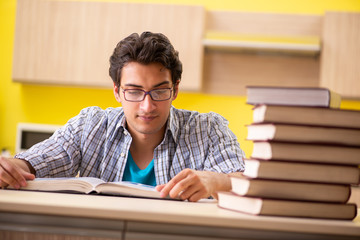 Student preparing for exam sitting at the kitchen 