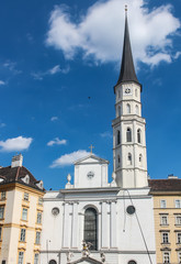 Fototapeta na wymiar clock tower on the building of the Church of St. Michael in Vienna Austria