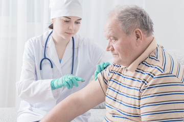 Vaccinating An Elderly Person