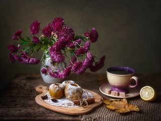 Still life with bouquet of chrysanthemums and baked apples