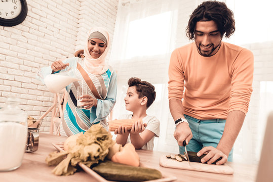 Happy Arabian Family Cooking Food in Kitchen.