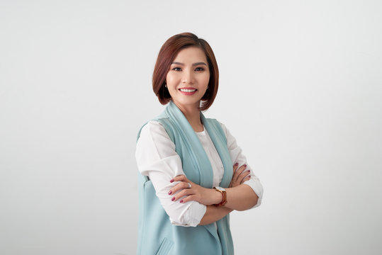 Entrepreneur young asian woman, business woman arms crossed on white background.
