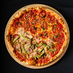 pizza on the black background