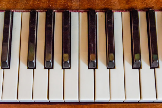 Closeup of the black and white piano keys. Top view