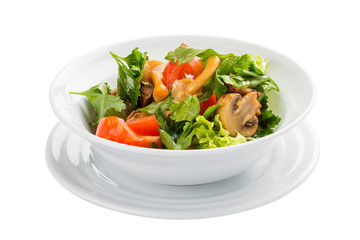Vegetable salad with mushrooms and greens on a white background