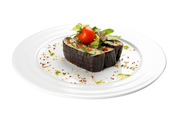 Aubergine grilled with vegetables on a white background. Vegetarian dish