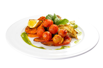 Roasted vegetables in Genoese. Fennel, tomatoes, lemon, sweet pepper, pumpkin, carrots.