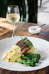 grilled salmon fish fillet with mashed potato and mustard sauce