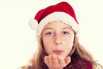 girl with Santa- Claus cap blowing over the hand