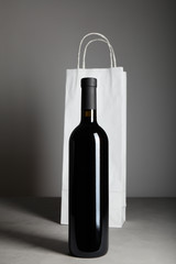 Bottle of red wine, an alcoholic beverage.