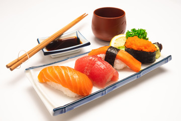 Sushi salmon & tuna sushi shrimp and wasabi on the white plate isolated.selective focus