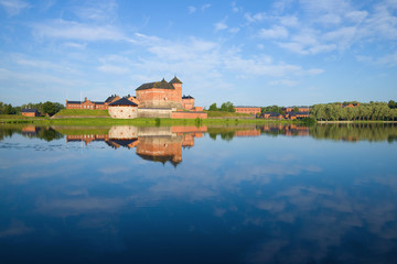 Panorama of Vanajavesi lake overlooking the ancient fortress of Hameenlinna on a sunny July morning. Finland