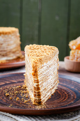 Traditional Honey Cake on a plate and on a wooden table