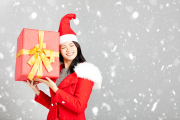 young woman with christmas gift box