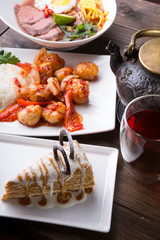 Asian lunch served on a wooden table